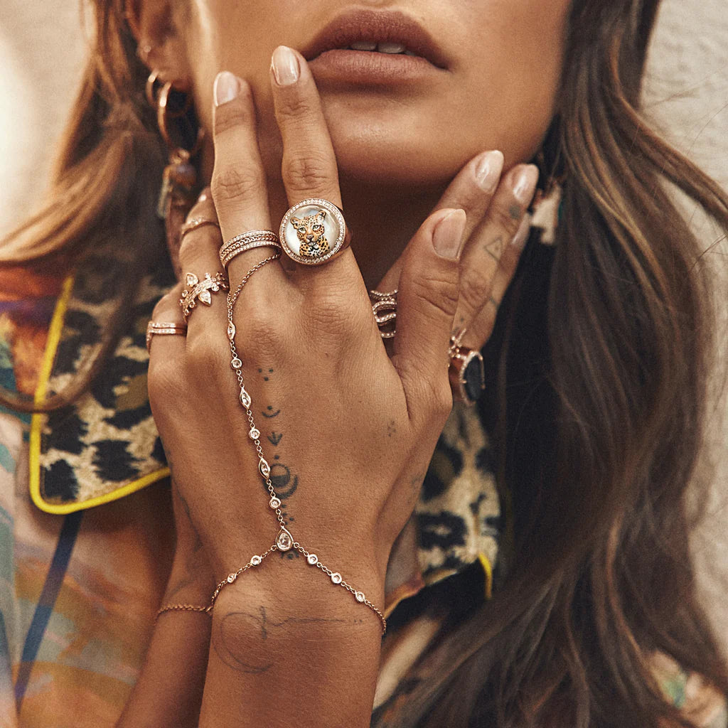 Rose cut teardrop diamond center round and marquise alternating finger bracelet