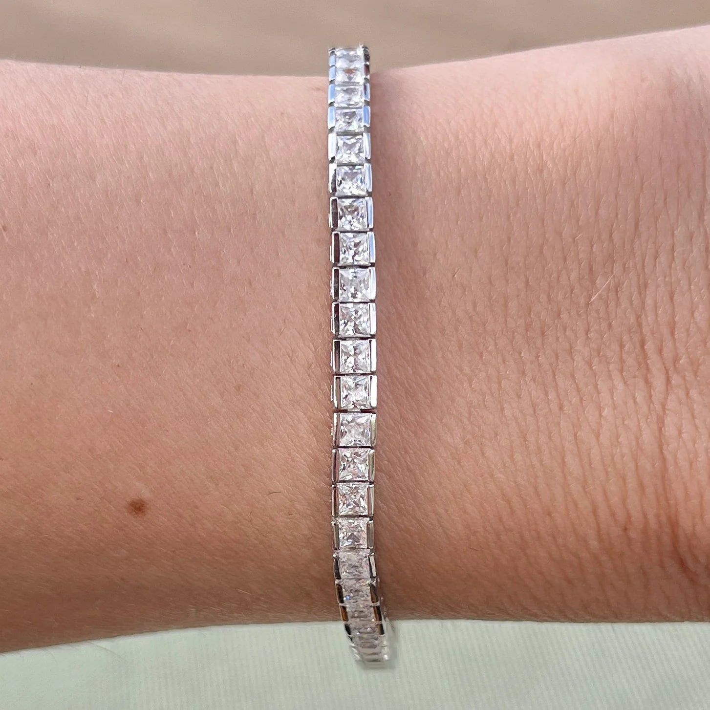 THE PRINCESS CUT CHANNEL SET TENNIS BRACELET