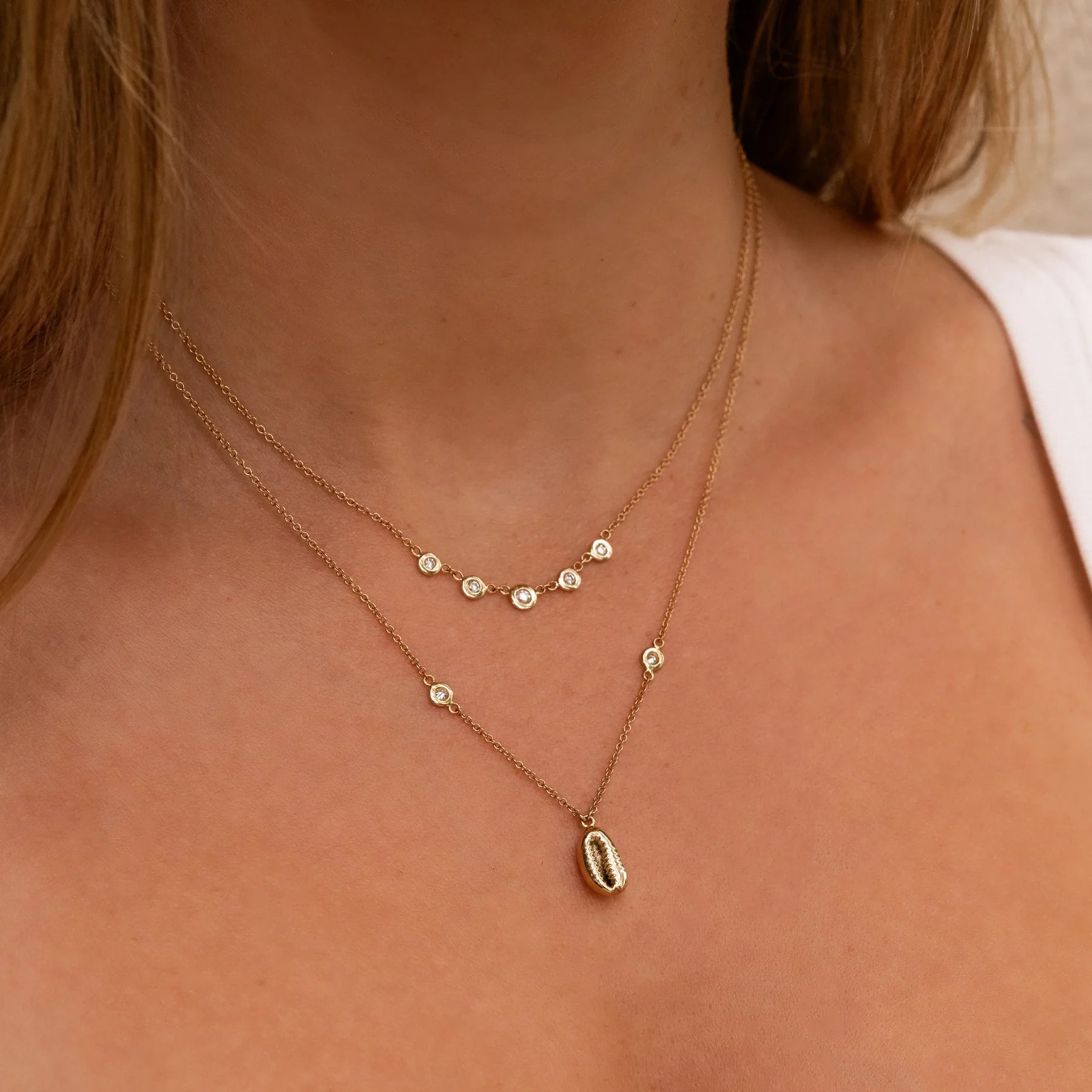 Tiny cowrie shell diamond necklace