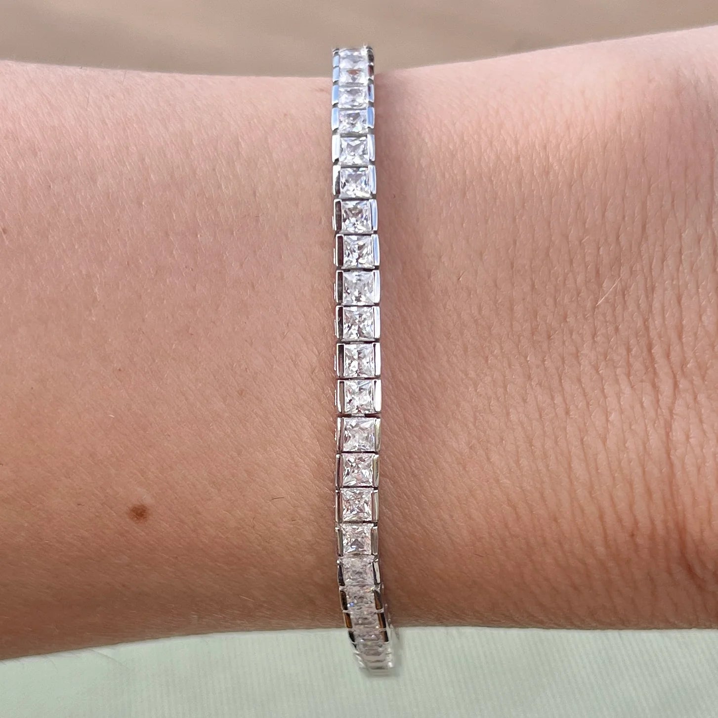 PRINCESS CUT CHANNEL SET TENNIS BRACELET